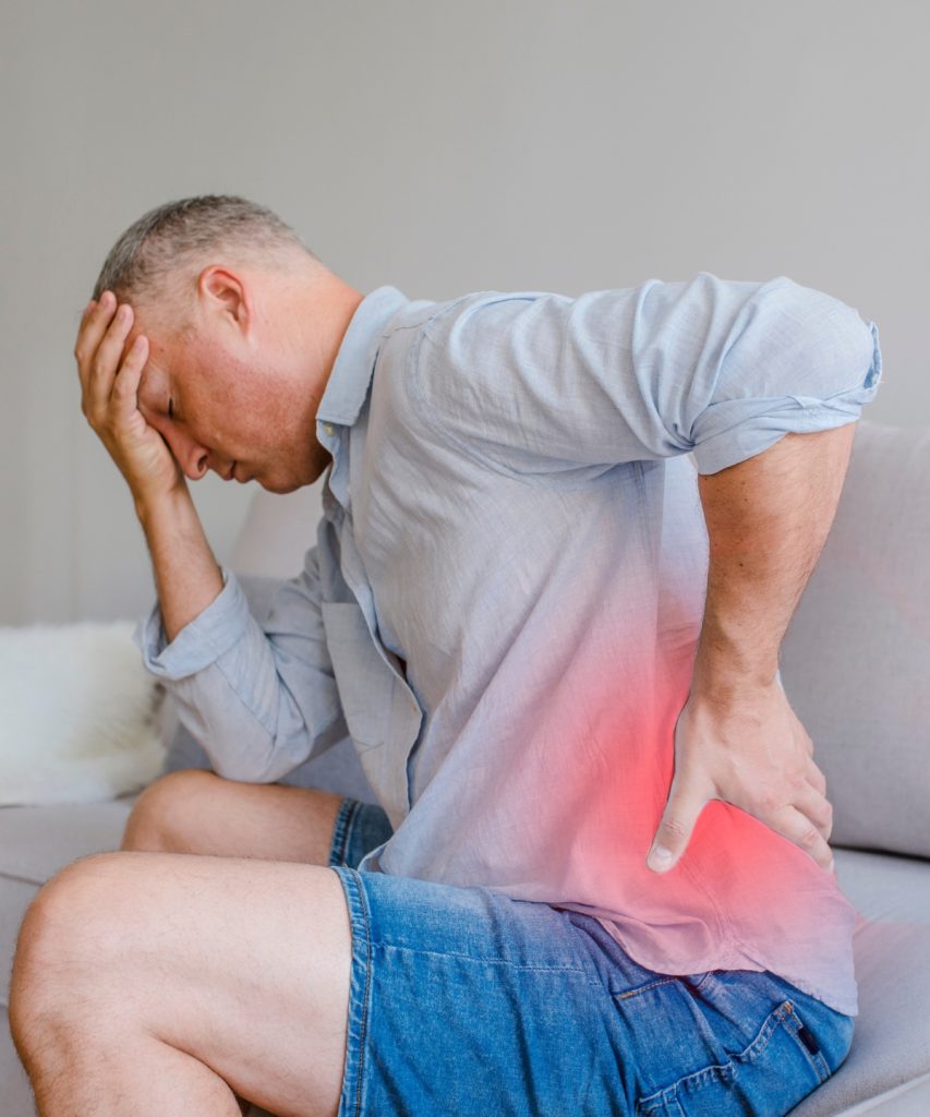 Man with severe back and hip pain visiting chartered physiotherapist in Dundalk offering Physiotherapy services 