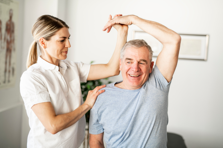 Chartered physiotherapist attending patient of physiotherapy for pain relief